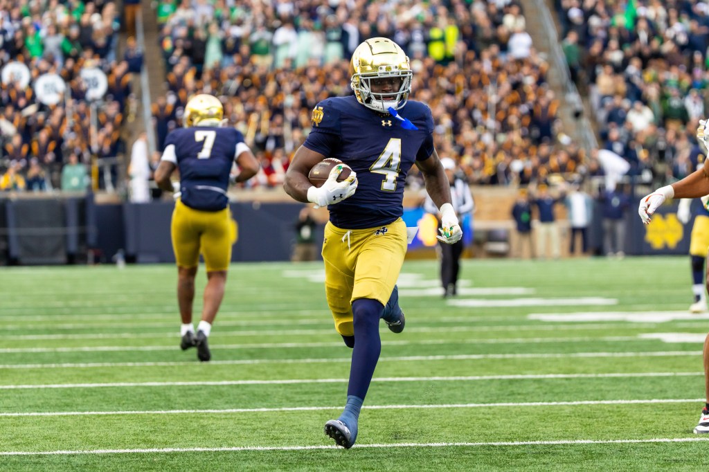 Notre Dame Fighting Irish running back Jeremiyah Love (4) breaks loose for a touchdown run against the Syracuse Orange during the first half at Notre Dame Stadium. 