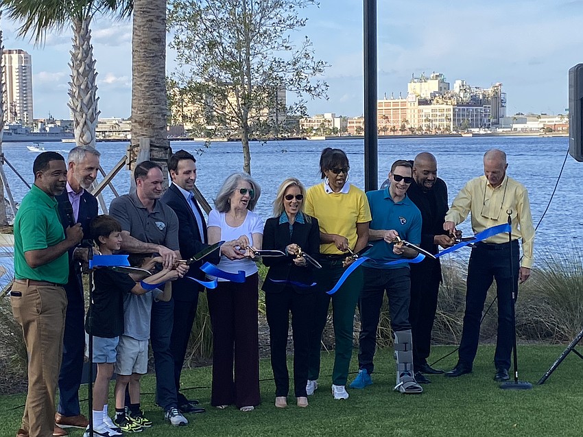 Jacksonville Mayor Donna Deegan, center, Council members and officials cut the ribbon Nov. 24 to celebrate the opening of the RiversEdge public parks on the Downtown Southbank. Jacksonville Mayor Donna Deegan, center, Council members and officials cut the ribbon Nov. 24 to celebrate the opening of the RiversEdge public parks on the Downtown Southbank.