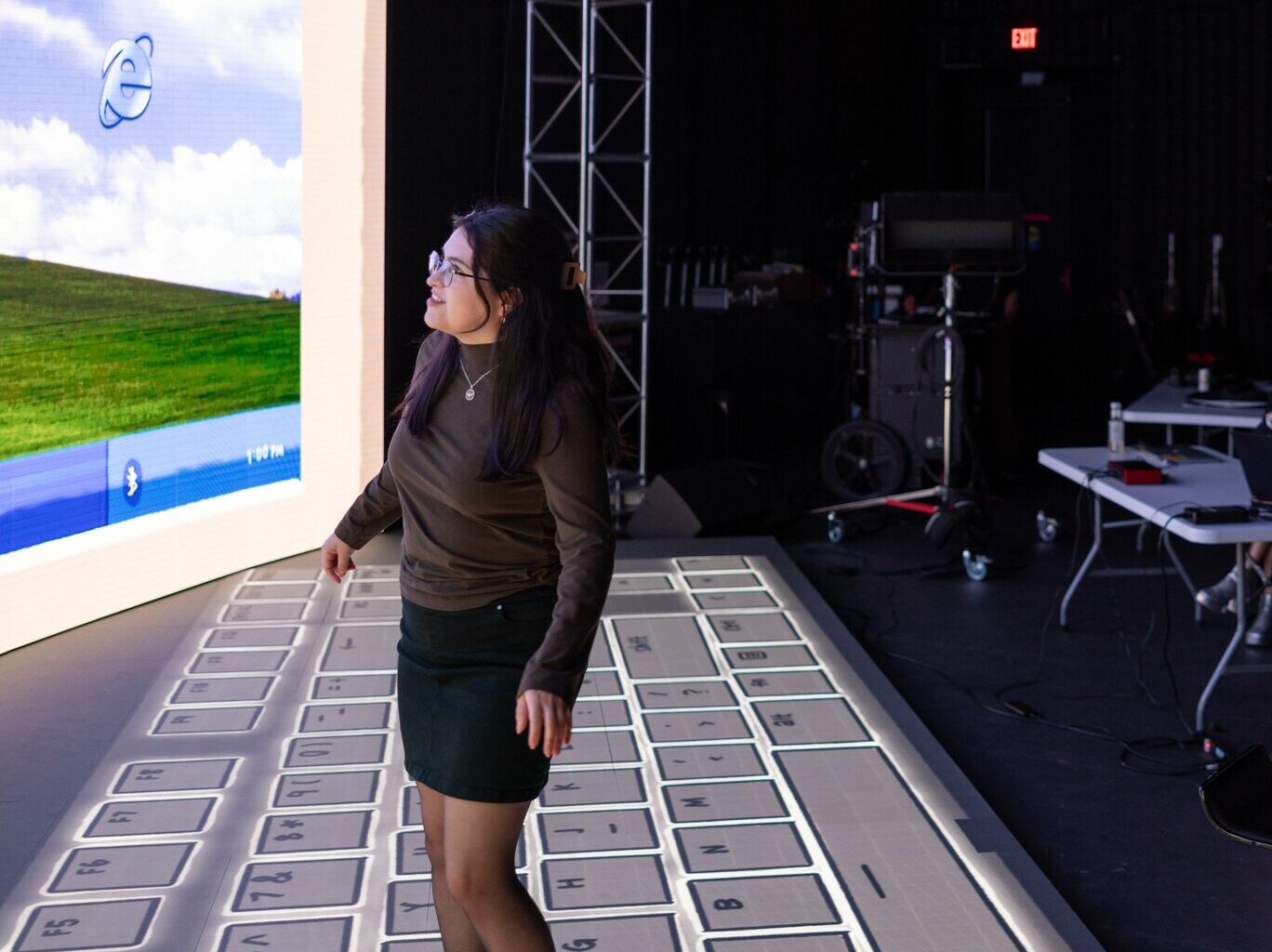 Lilliana Lopez, a MSD immersive experience design student, fine-tunes equipment and demonstrates projects at the ASU MIX Center in Mesa, part of the Herberger Institute for Design and the Arts.