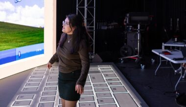 Lilliana Lopez, a MSD immersive experience design student, fine-tunes equipment and demonstrates projects at the ASU MIX Center in Mesa, part of the Herberger Institute for Design and the Arts.