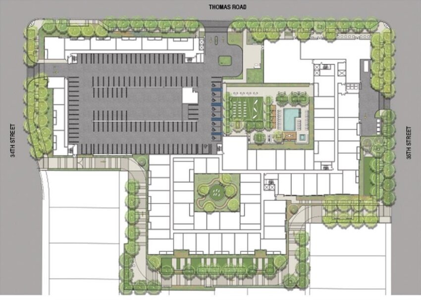 A site plan sketch of the apartment building, including the four-story parking garage in gray and two open space areas.