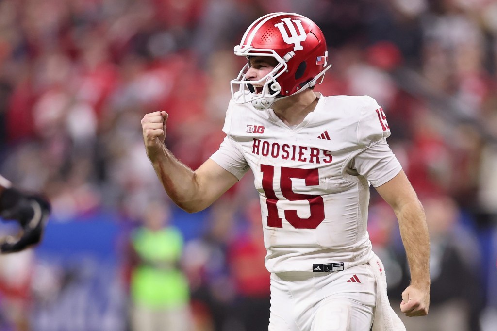 Fernando Mendoza #15 of the Indiana Hoosiers celebrates a touchdown against the Ohio State Buckeyes during the third quarter in the 2025 Big Ten Football Championship at Lucas Oil Stadium on December 06, 2025 in Indianapolis, Indiana. 