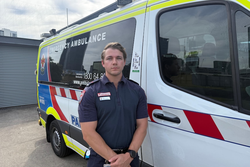 Paramedic Luke Harrington speaks to media at a press conference.