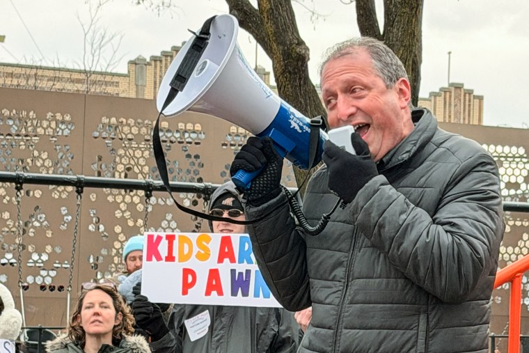 Brad Lander speaks into a megaphone