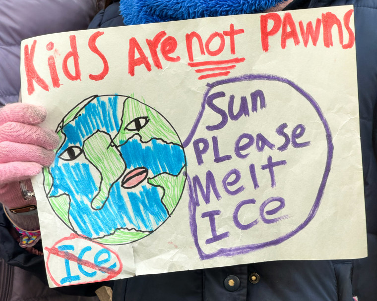 A pink gloved hand holds a sign that reads "Kids are not pawns" with a drawing of the Earth underneath, with a speech bubble that reads "Sun please melt ICE", and the word "ICE" is circled and crossed out in the corner