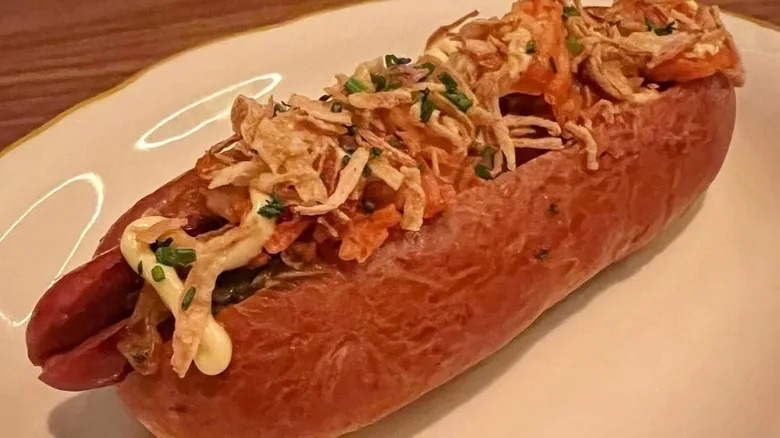 a hot dog on a china plate