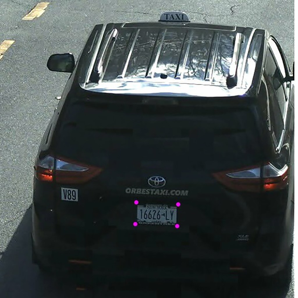 Rear view of a black Toyota Sienna taxi with New York license plate 16626-LY, and "ORBESTAXI.COM" on the back.