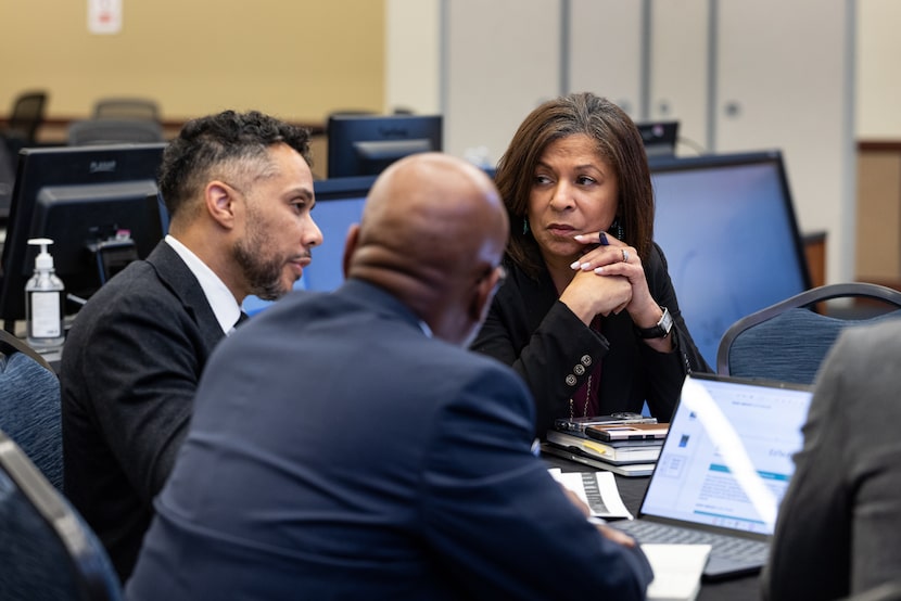 Dallas ISD Chief of Communications Libby Daniels listens to Chief Construction Officer Brent...