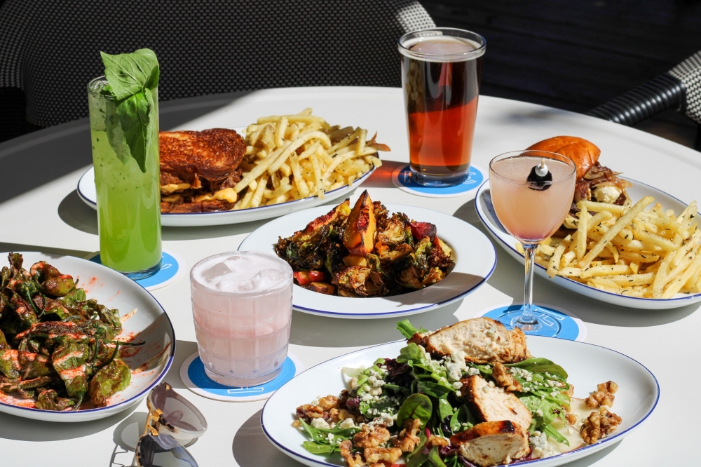 array of food and drinks on a white table