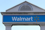 In this Tuesday, Sept. 3, 2019, file photo, a Walmart logo forms part of a sign outside a...
