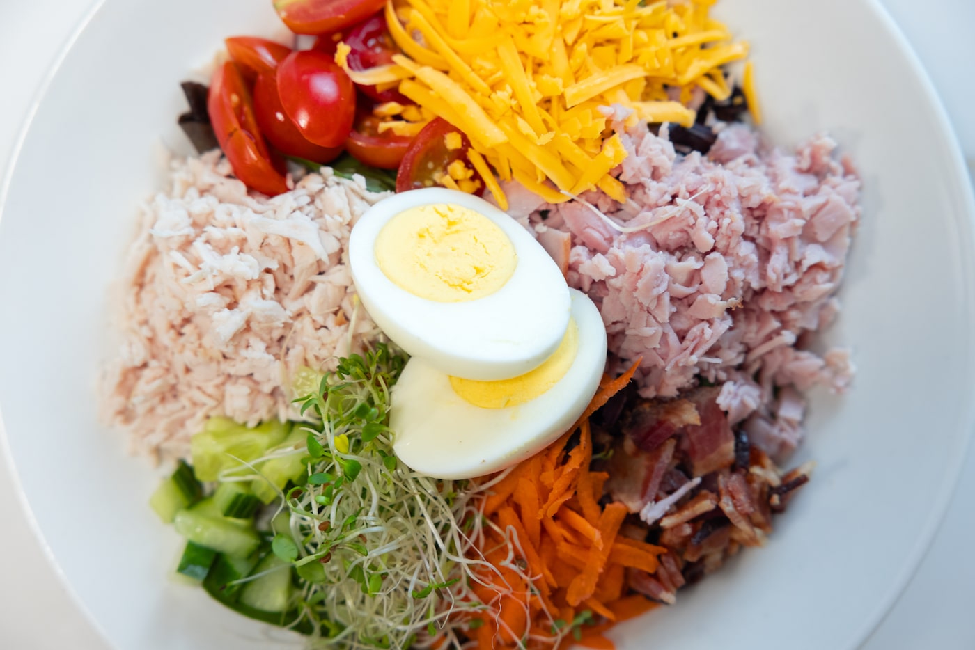 The "Reagans Sprouts" salad is seen at the new Hugs Cafe location in Dallas Dec. 8, 2025. It...