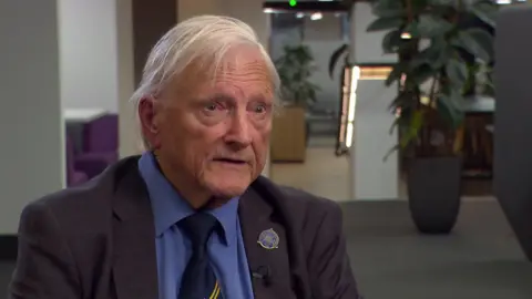 David Jones, an elderly man with white hair, pictured wearing a suit