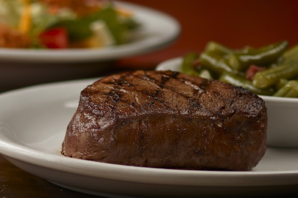 A steak is seen on a plate at a Texas Roadhouse location.