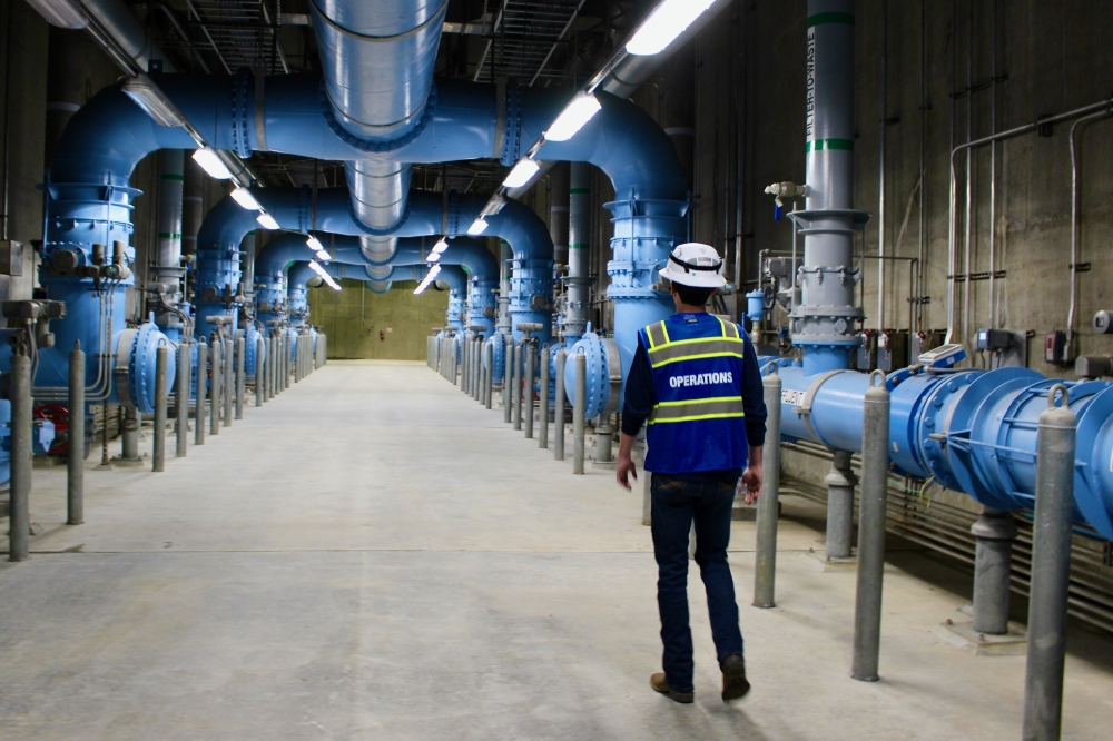 Masson Henderson, a water plant operator for the North Texas Municipal Water District, passes by filtration equipment at the Wylie Water Treatment Plant. Purified water flows through the equipment before being distributed to the select North Texas cities, including McKinney. (Shelbie Hamilton/Community Impact)