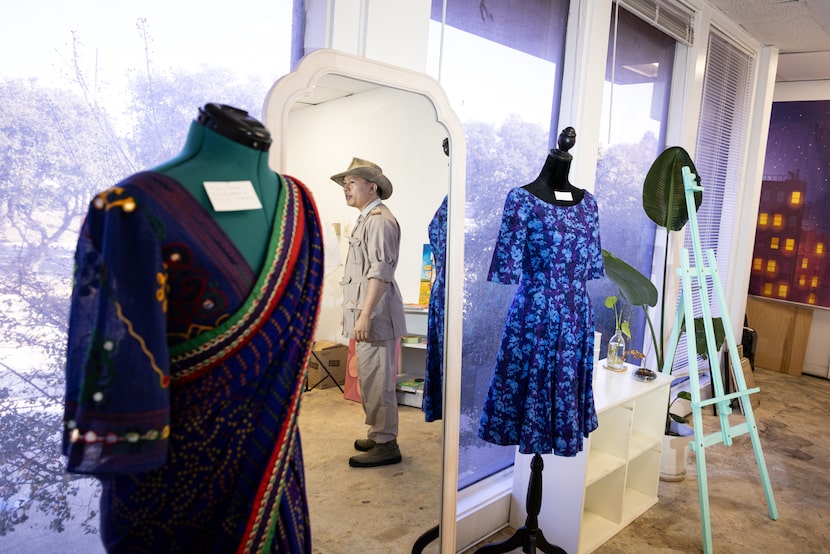 Goldmark Cultural Center Executive Director Joseph Yeh is reflected in a mirror inside of a...