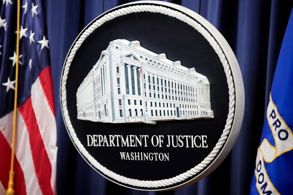 Mark Schiefelbein/AP, FILE - PHOTO: The logo for the Justice Department is seen before a news conference at the Department of Justice, Aug. 23, 2024, in Washington, D.C.