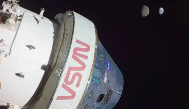 The Orion Capsule takes a "selfie" with the Moon and Earth. Credit - NASA