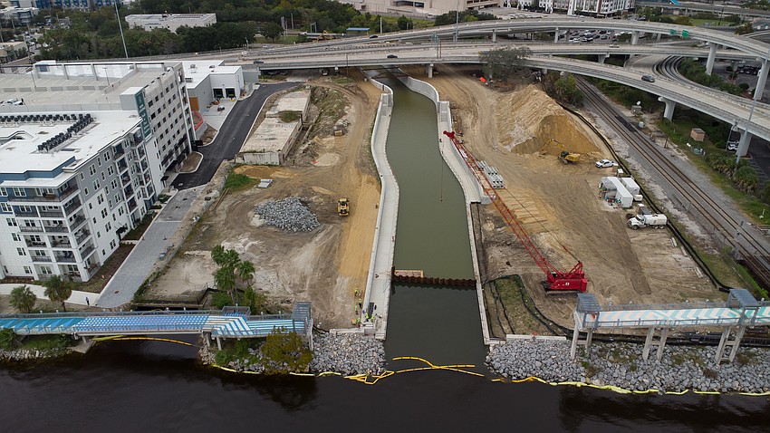 An aerial view of McCoys Creek before the dam was lifted for water to flow into the St. Johns River. To the left is the One Riverside development, the former Florida Times-Union property. The Acosta Bridge is to the right. An aerial view of McCoys Creek before the dam was lifted for water to flow into the St. Johns River. To the left is the One Riverside development, the former Florida Times-Union property. The Acosta Bridge is to the right.