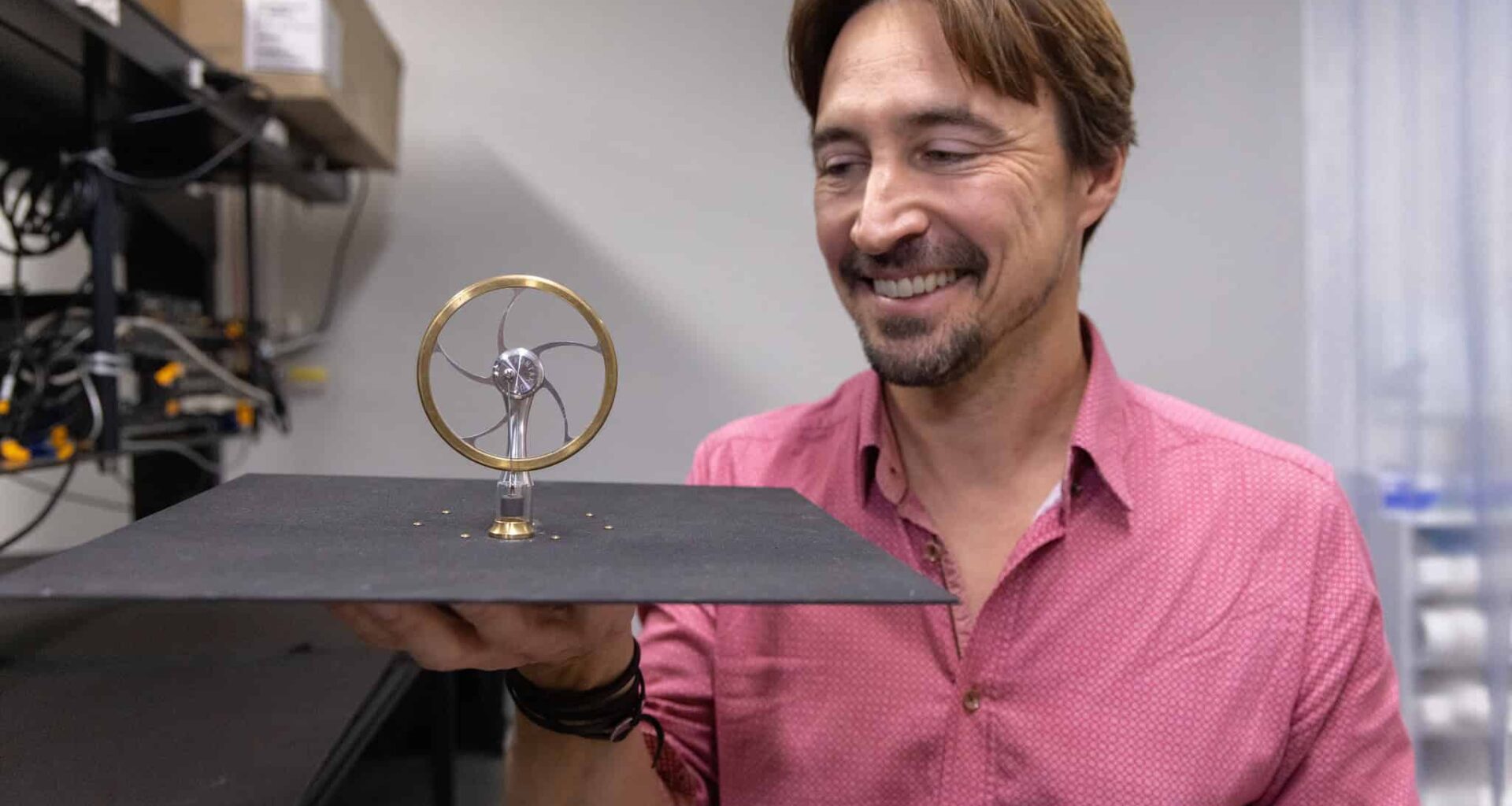 Image of the radiative engine for generating power at night being held by it's designer