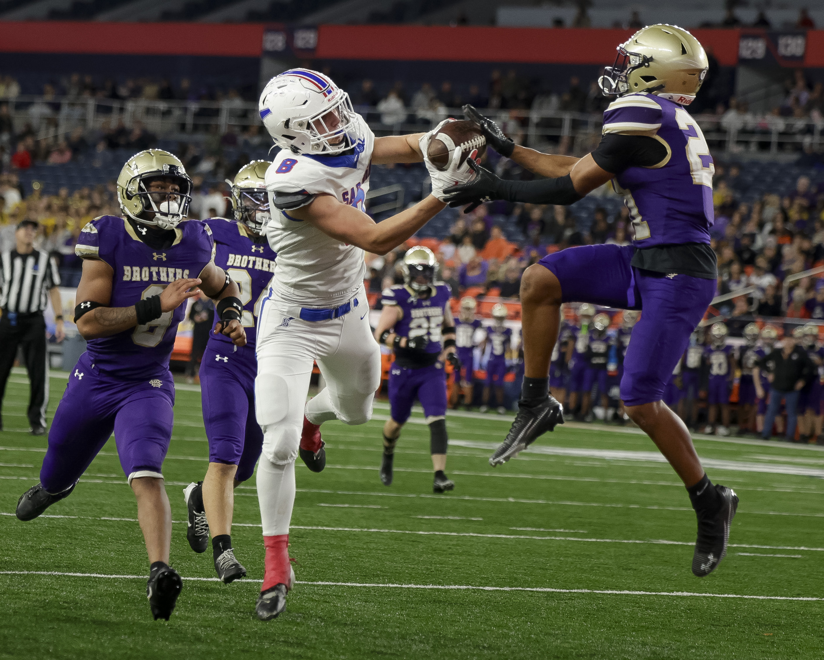 CBA Brothers defensive back Tre' Williams (10) interferes with the reception for Saratoga Springs Blue Streaks Joshua Simon (8) spoiling a touchdown attempt as the CBA Brothers and Saratoga Springs Blue Streaks fought for the New York State Class AA state title at JMA Wireless Dome Saturday, December 6, 2025. (N. Scott Trimble | strimble@syracuse.com)