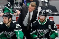 Dallas Stars head coach Glen Gulutzan talks with Dallas Stars center Tyler Seguin (91) as...