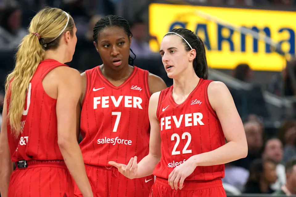 Indiana Fever guard Caitlin Clark (22), guard Lexie Hull (10) and forward Aliyah Boston (7).
