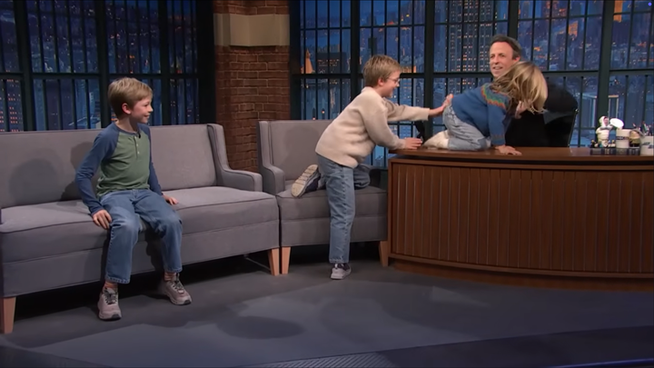 Seth Meyers’ three kids — Ashe (L) Axel (C) and Adelaide (on desk) — cause a kerfuffle on “Late Night with Seth Meyers.”