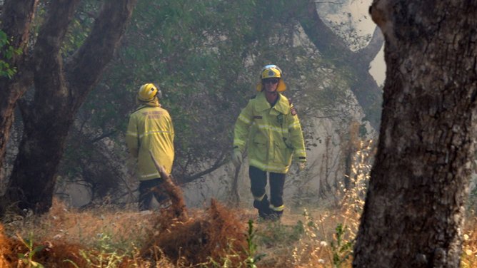Emergency services at the scene of a bushfire at Herdsman Lake in Osborne Park on Saturday afternoon. 