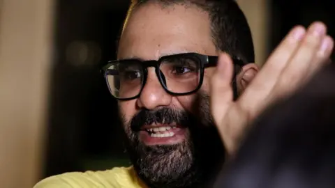 Reuters Alaa Abd El Fattah pictured smiling and gesturing