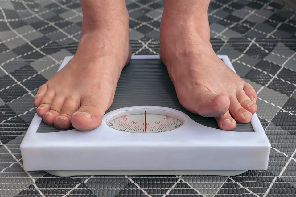 Getty Stock image of person weighing themselves.