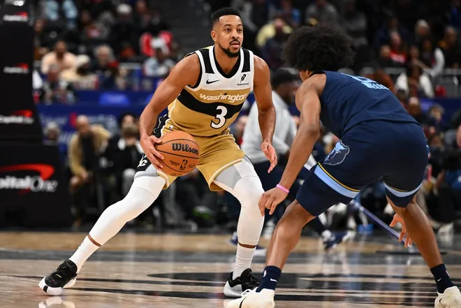 Dec 28, 2025; Washington, District of Columbia, USA; Washington Wizards guard CJ McCollum (3) dribbles against the Memphis Grizzlies during the second half at Capital One Arena.