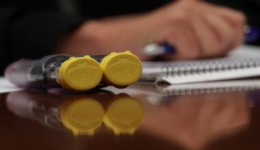 ACA marketplace navigators meet with people who need to buy coverage on their own at an event in 2022 in Nashville.