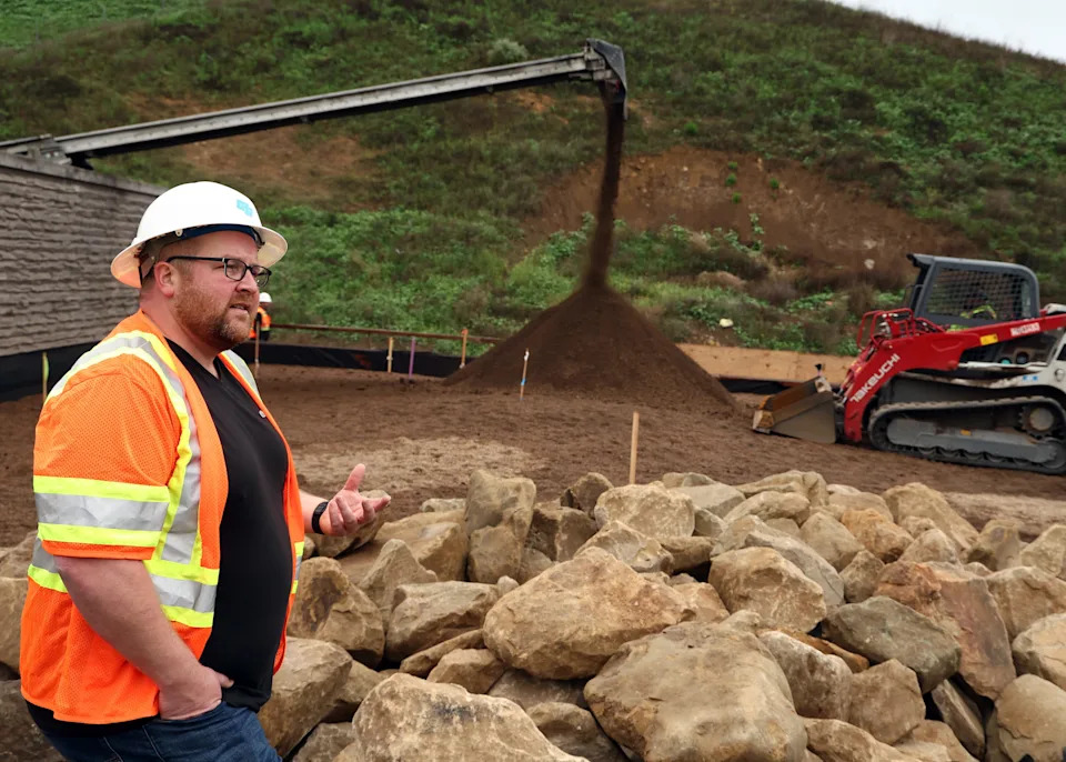 Robert Rock, of Rock Design and Associates, is seen working as the first layers of soil are placed on the Wallis Annenberg Wildlife Crossing on March 31, 2025 in Agoura Hills, California.