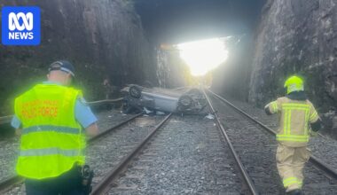 Car crashes onto train tracks, sparking travel delays in the Blue Mountains