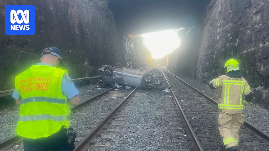 Car crashes onto train tracks, sparking travel delays in the Blue Mountains