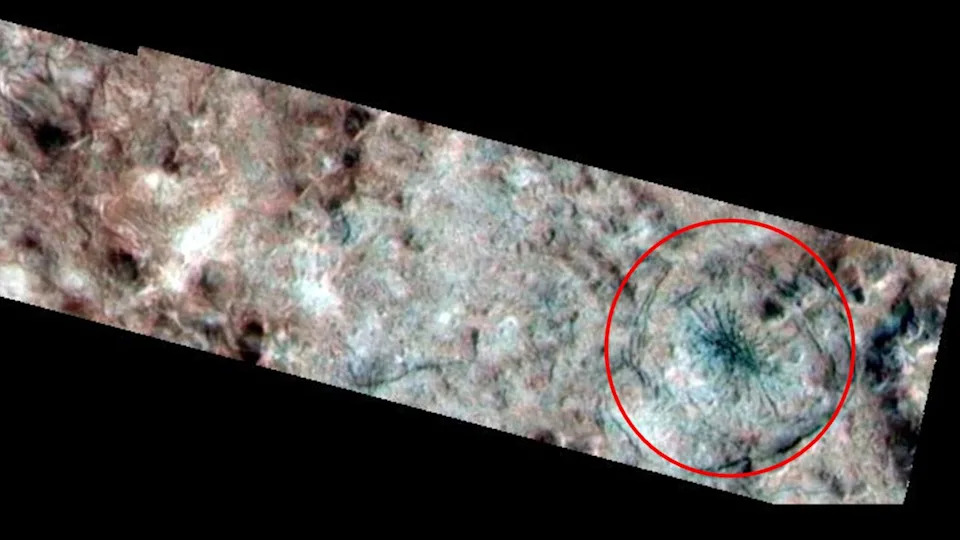 A photo of Europa's surface with a red ring around the spider-like feature.