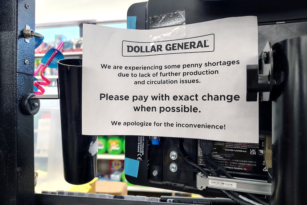 A sign at the register of a The Dollar General on Washington Boulevard in Baltimore this month asking customers to pay with exact change.