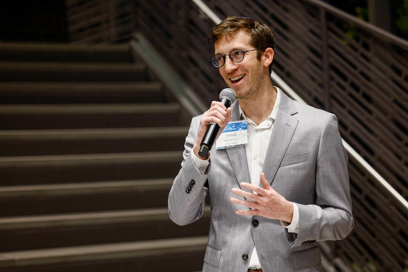 Temple Emanu-El Rabbi Michael Lewis speaks during a Hanukkah candle lighting and reception...