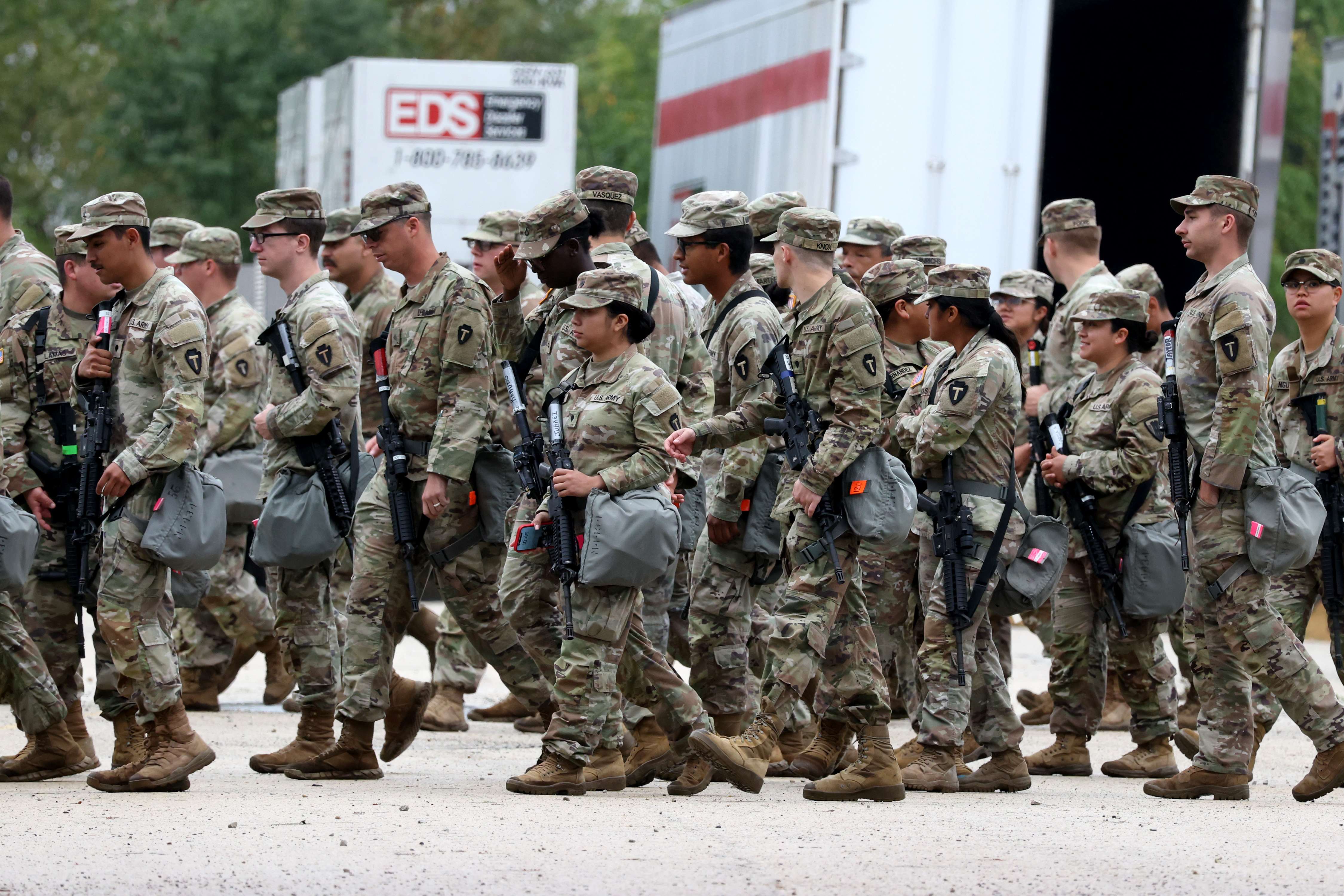 Members of the Texas National Guard assemble at the Army...