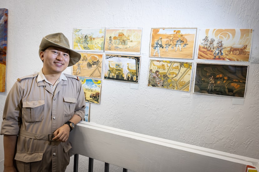 Goldmark Cultural Center Executive Director Joseph Yeh leans on a stairwell by his works of...