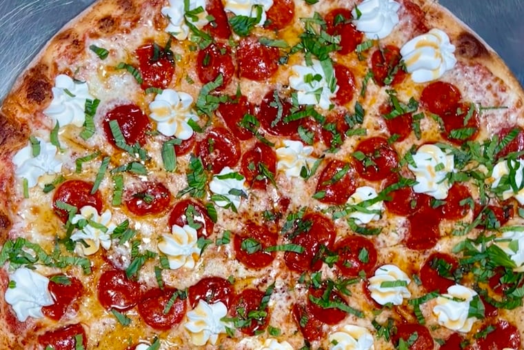 Pizza with pepperoni and ricotta at 15th Street Pizza & Cheesesteak.