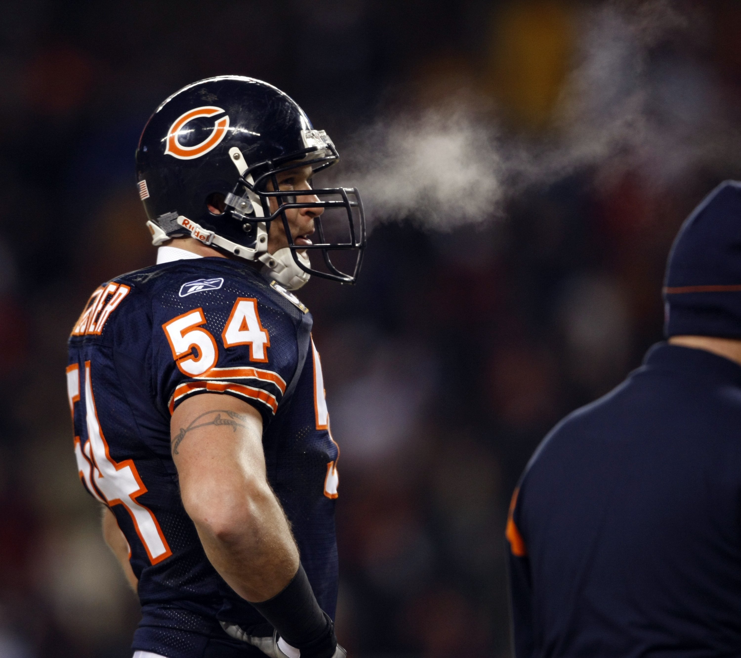 Chicago Bears' Brian Urlacher reacts after a successful fake punt...
