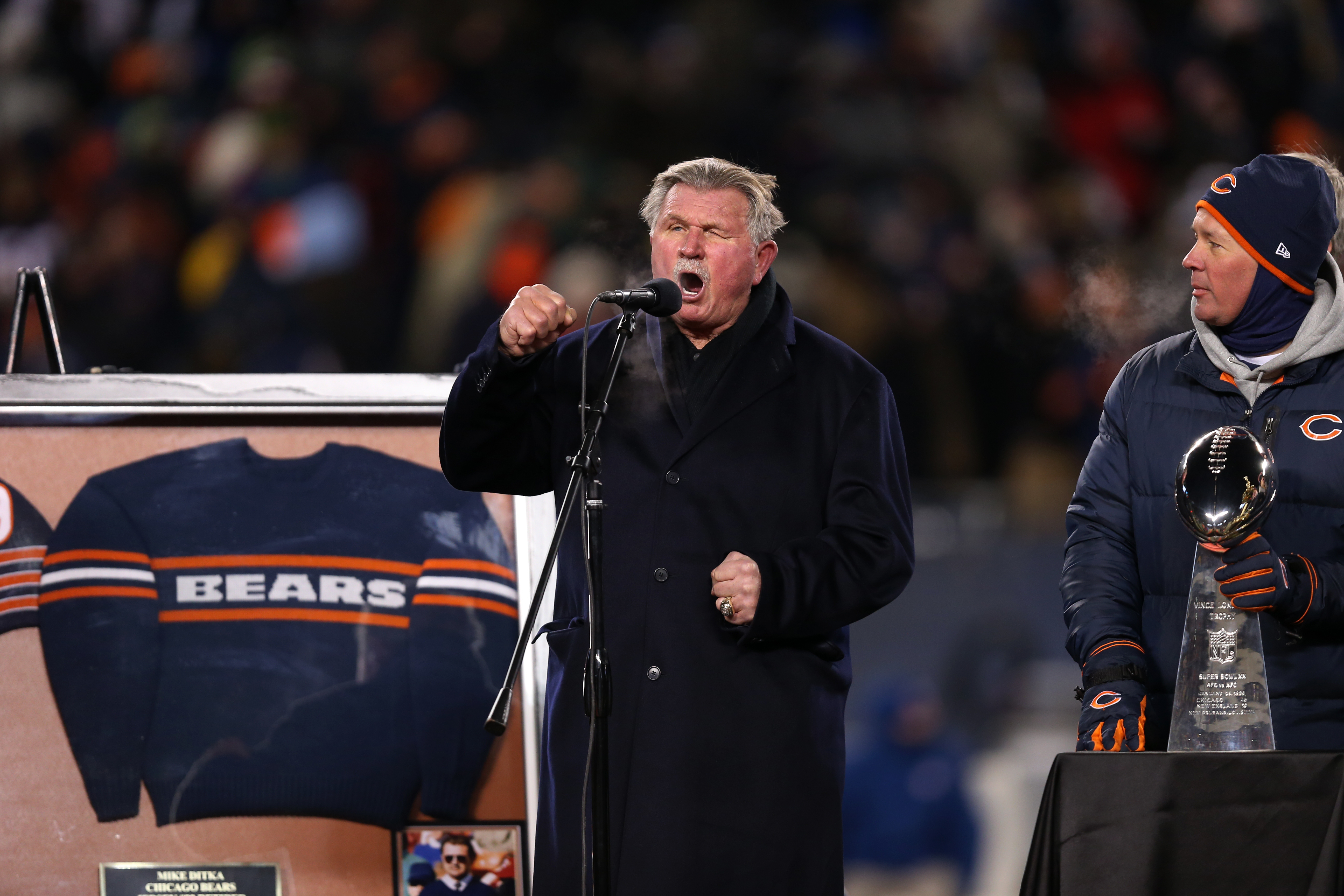 Mike Ditka gives a speech during a halftime ceremony to...