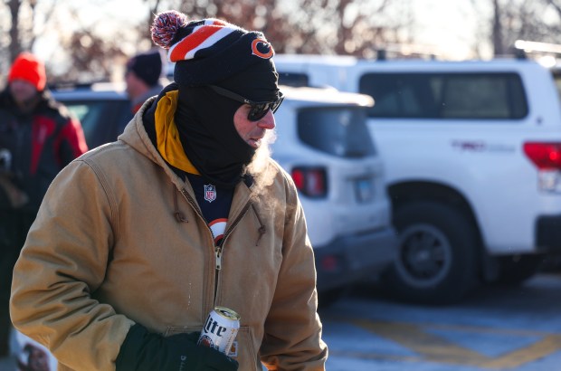 Erik Schilling of Batavia holds a beer while tailgating before a Bears-Browns game Sunday, Dec. 14, 2025, at Soldier Field. (Dominic Di Palermo/Chicago Tribune)