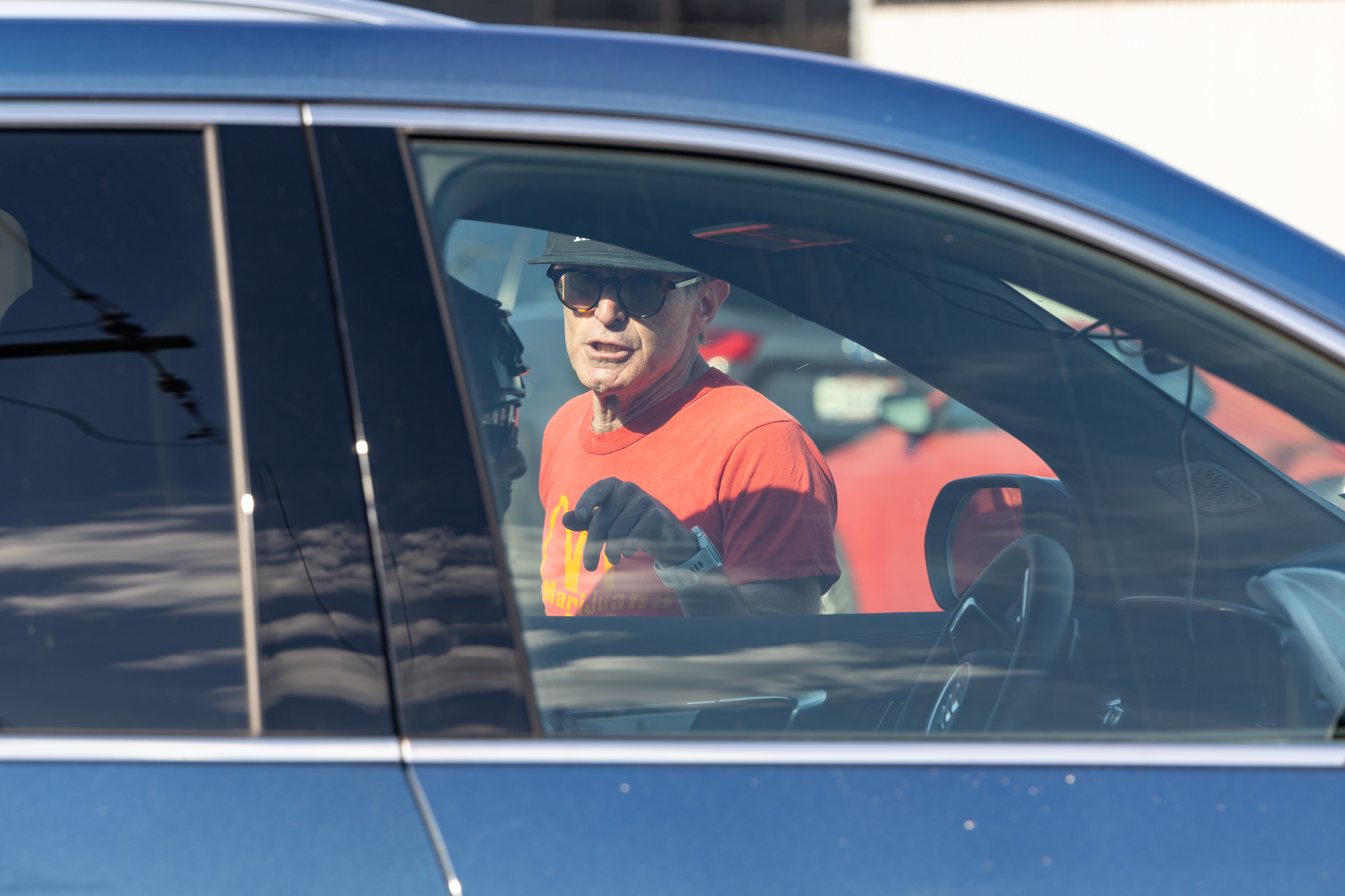 A protester yells at a federal agent attempting to enter...