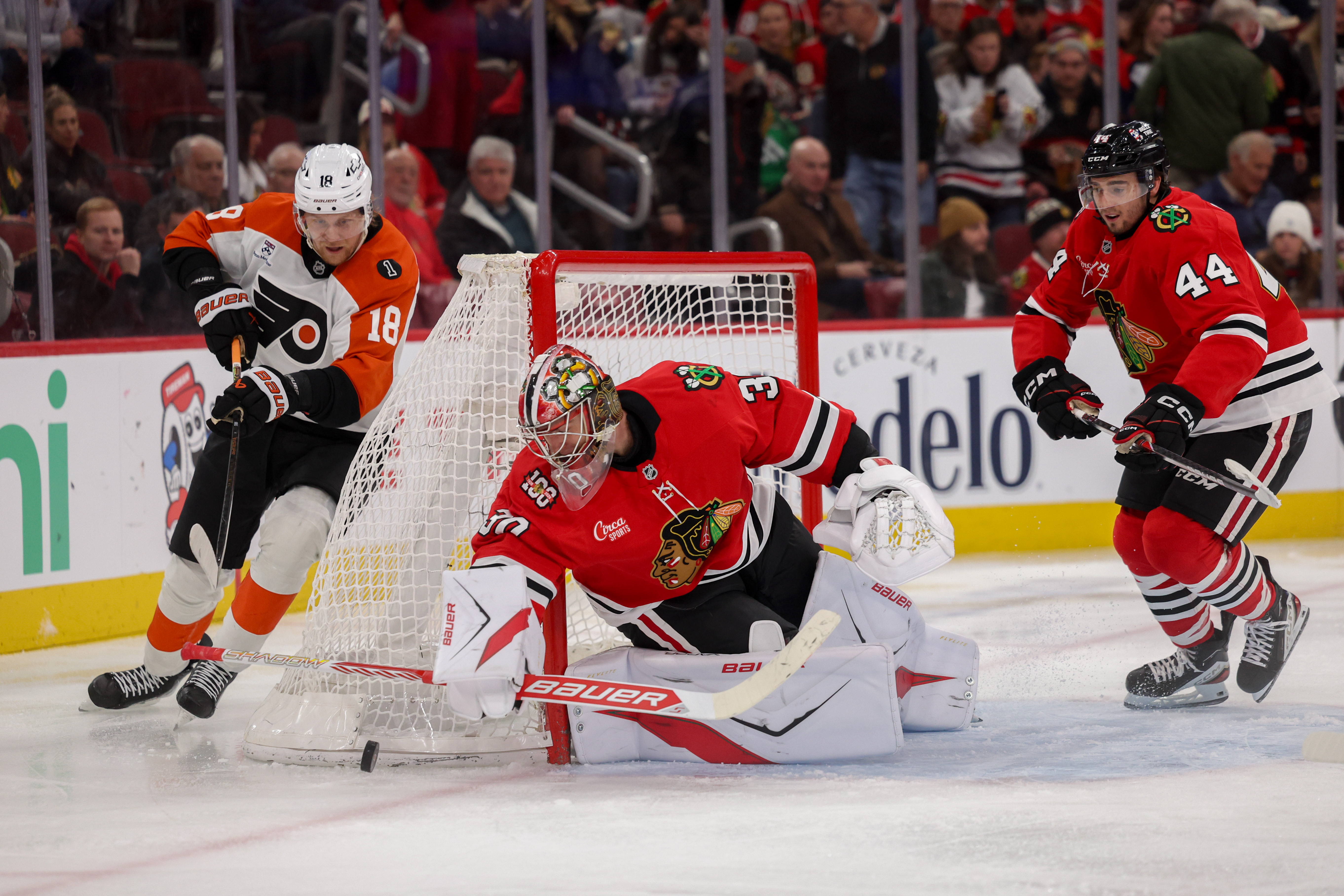 Chicago Blackhawks goaltender Spencer Knight (30) blocks a shot from Philadelphia Flyers center Rodrigo Abols (18) during the second period at the United Center Tuesday Dec. 23, 2025 in Chicago. (Armando L. Sanchez/Chicago Tribune)