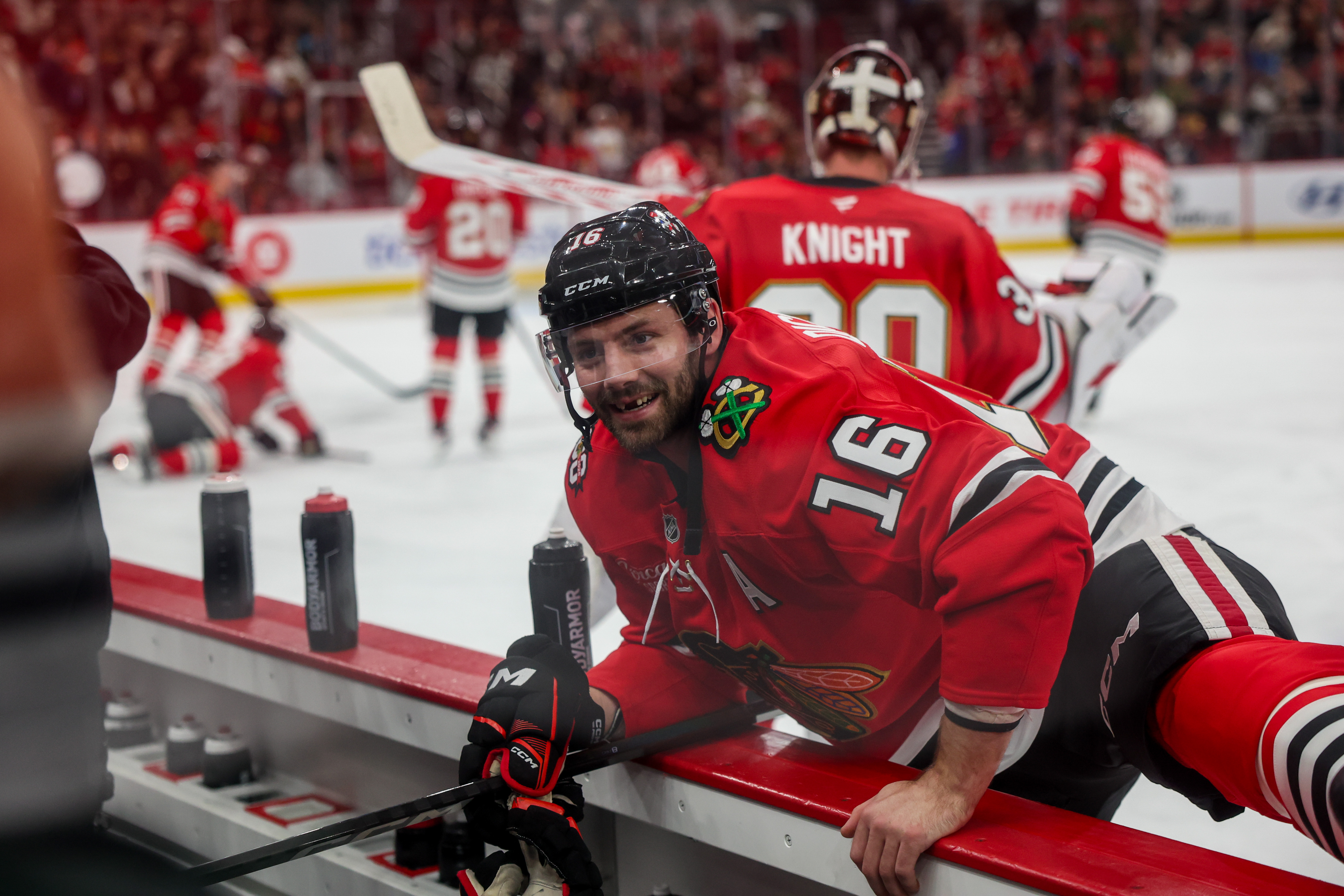 Chicago Blackhawks center Jason Dickinson (16) smiles while stretching before playing the Philadelphia Flyers at the United Center Tuesday Dec. 23, 2025 in Chicago. (Armando L. Sanchez/Chicago Tribune)