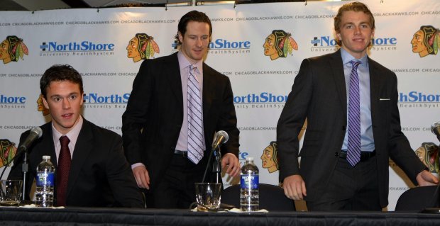 Chicago Blackhawks players Jonathan Toews, left, Duncan Keith, center, and Patrick Kane meet with reporters on Dec. 3, 2009, after signing contract extensions with the team at the United Center. (Phil Velasquez/Chicago Tribune)