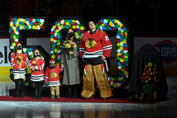Chicago Blackhawks goalie Marc-Andre Fleury (29) stands with his family as he was honored for 500 career wins before an NHL hockey game against the Washington Capitals, on Dec. 15, 2021, in Chicago. (Matt Marton/AP)