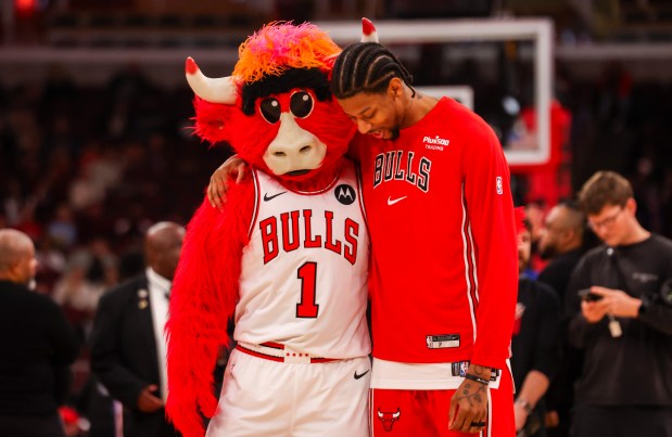 Chicago Bulls guard Dalen Terry (7) hugs Benny the Bull during warm ups before game against the Philadelphia 76ers, Friday, Dec. 26, 2025, at the United Center in Chicago. (Dominic Di Palermo/Chicago Tribune)